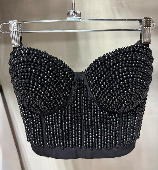 Top tipo corset con perlas negras